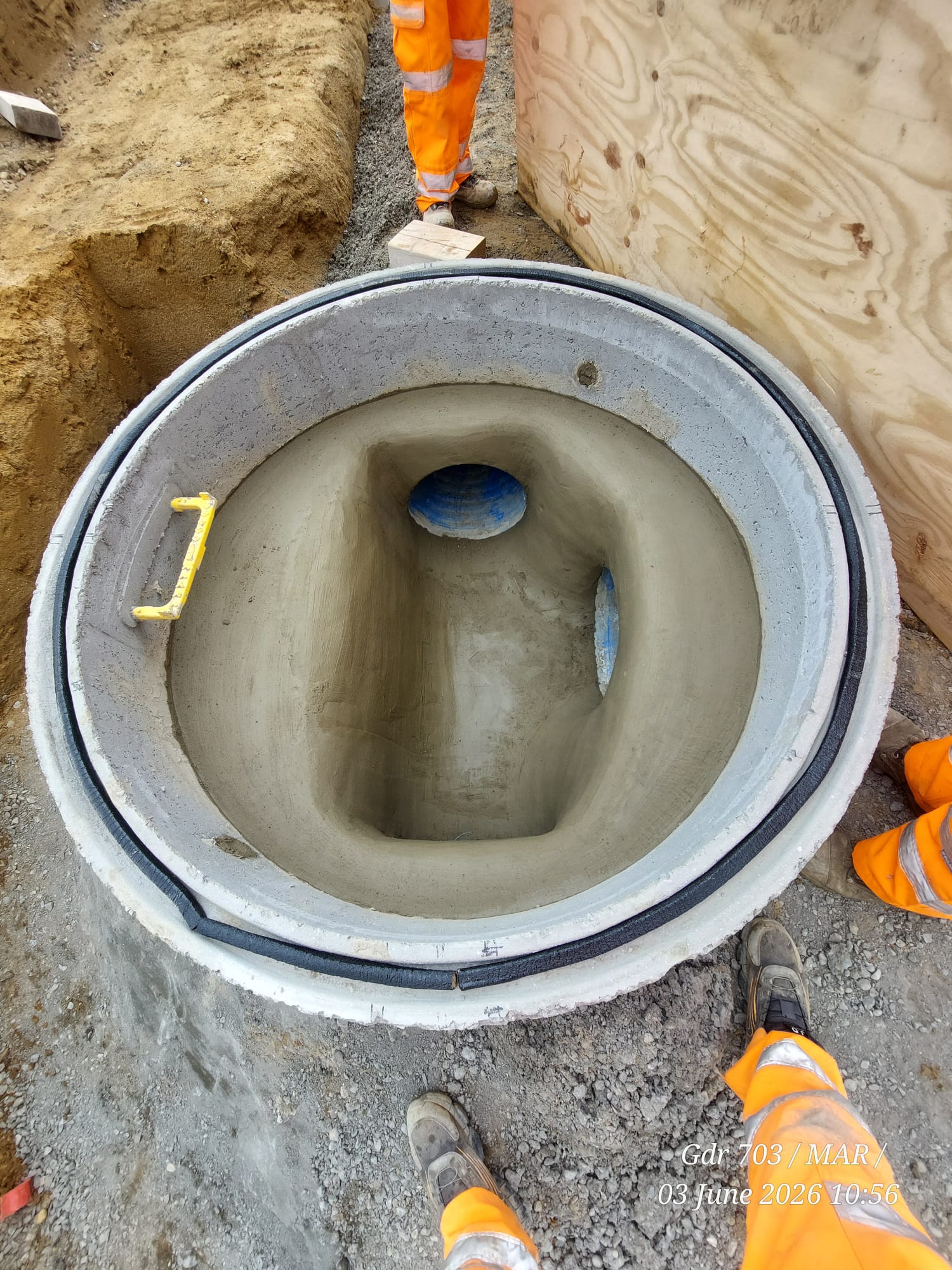 Deep drainage excavation with plant working on a large construction site