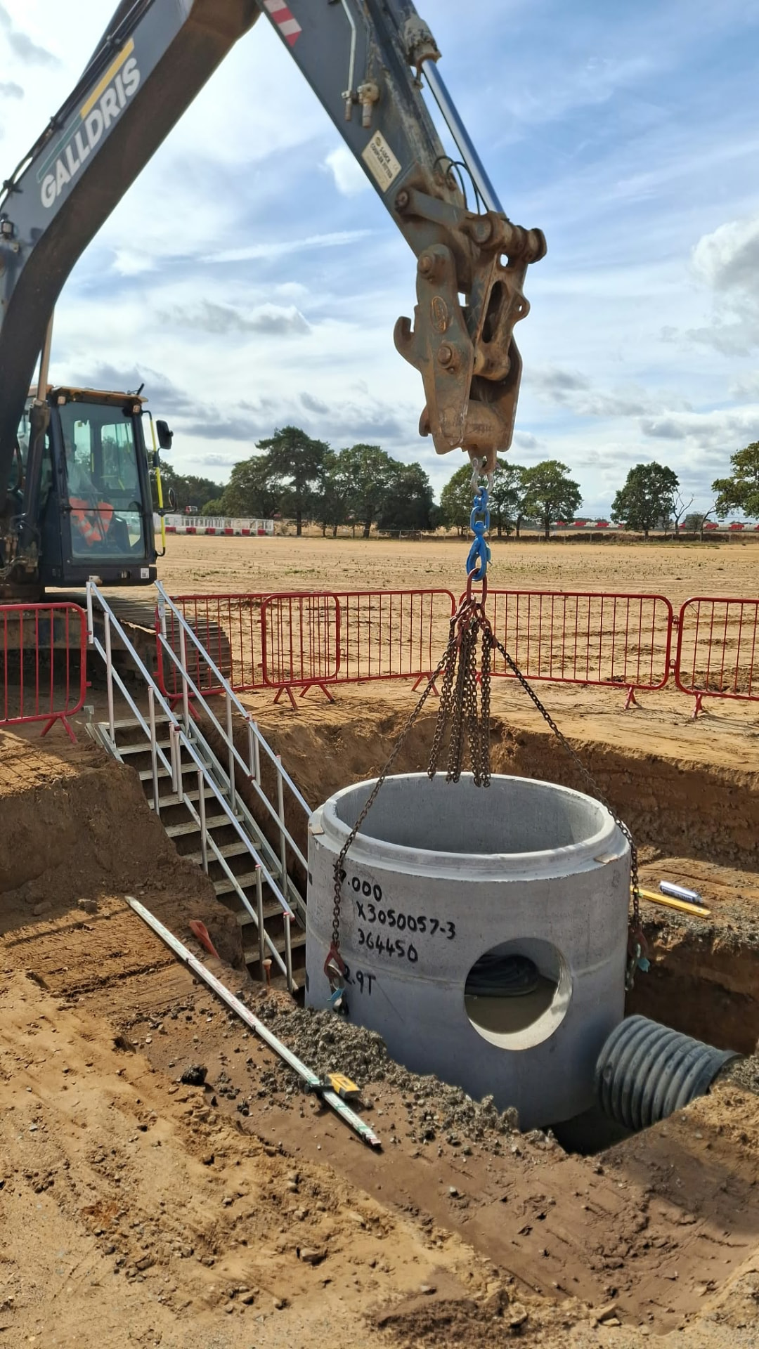 Concrete manhole set into a deep drainage run