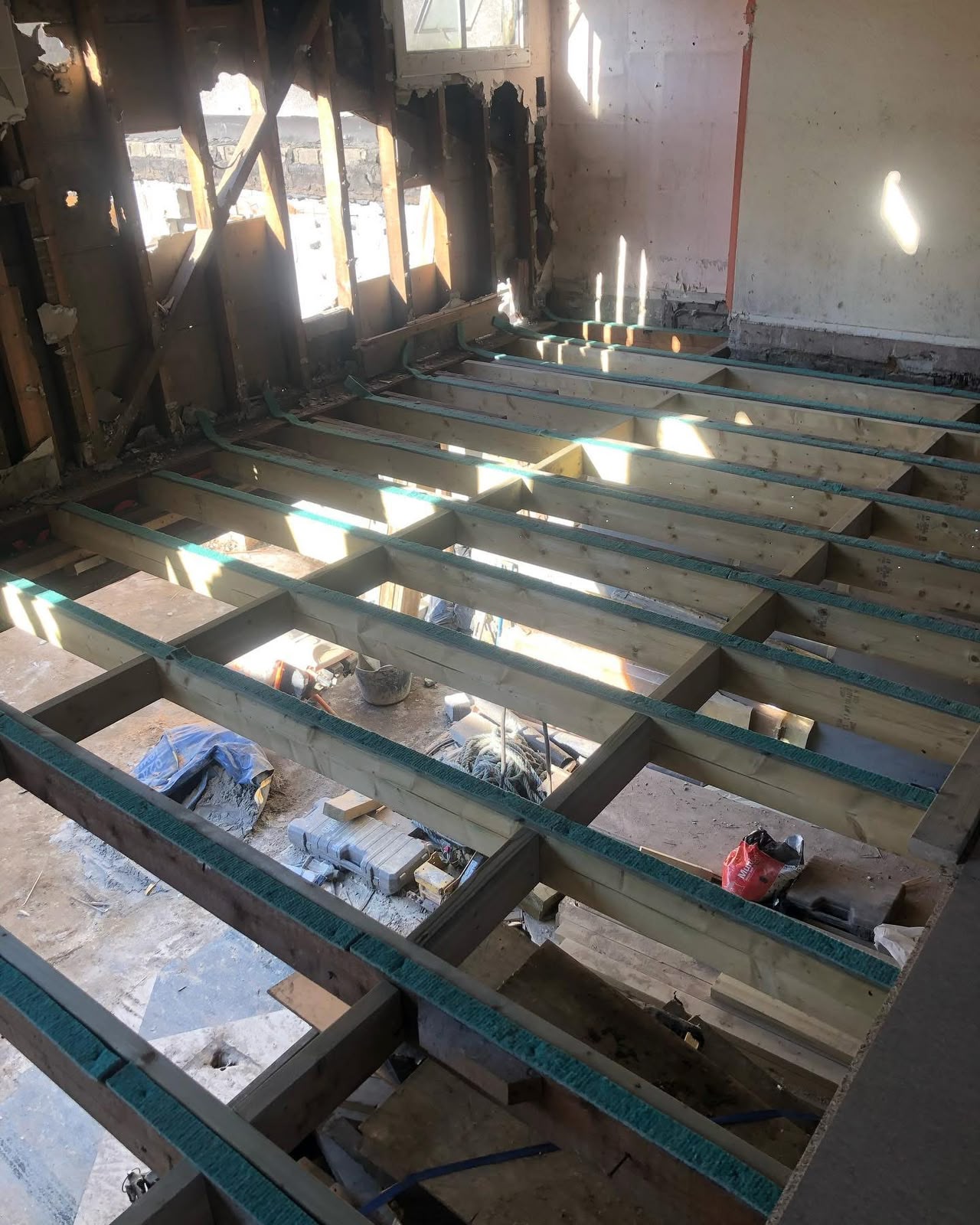 Joist grid prepared for acoustic insulation on a commercial refurbishment in Cornwall