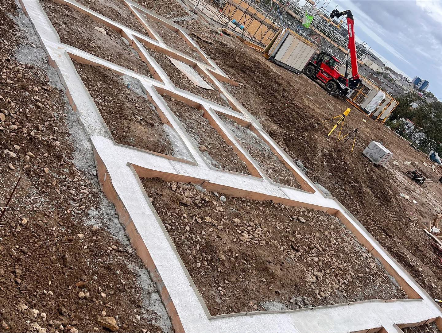 Steel reinforcement cages set in ground beams on a piled foundation in Camborne