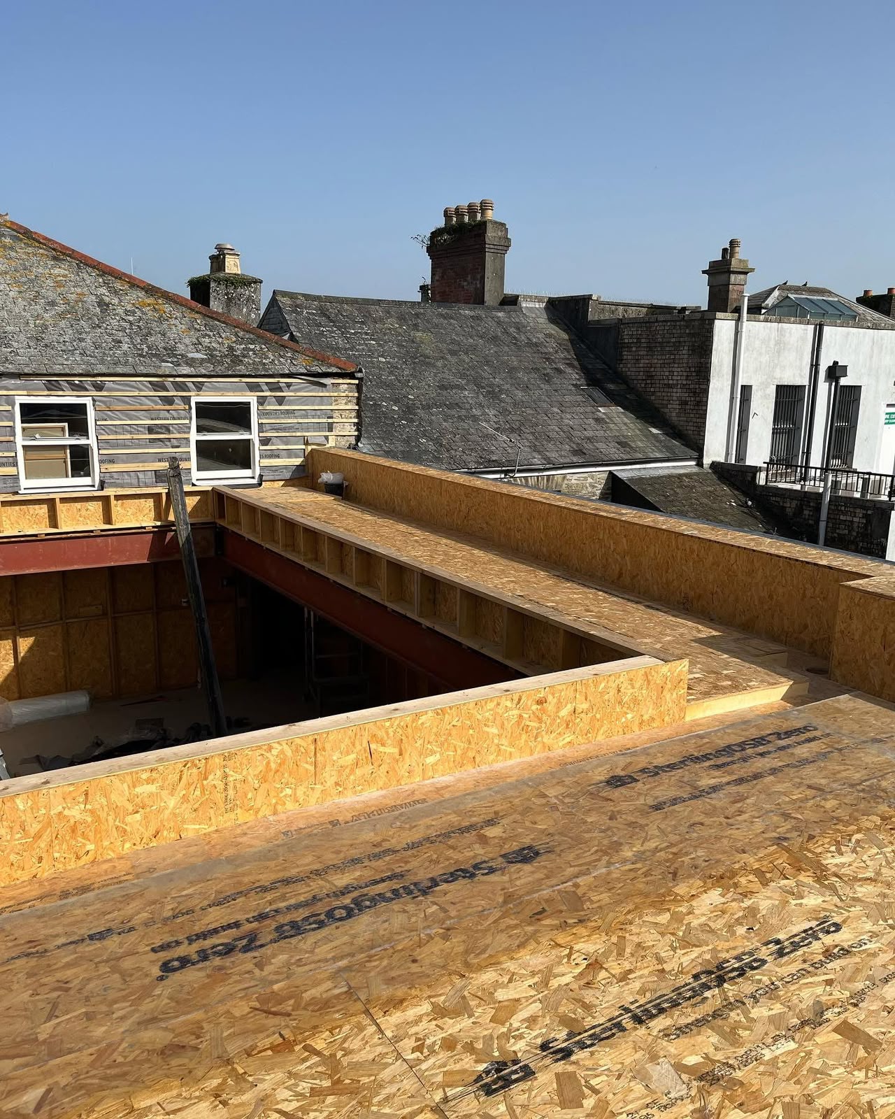 Flat roof edge detail under construction on a commercial refurbishment